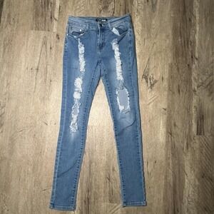 Fashion Nova blue distressed skinny jeans
